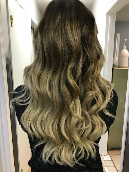 Blonde hair extensions. Ombre color..