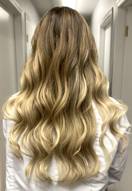 Spiral curled, ombre color hair extensions.